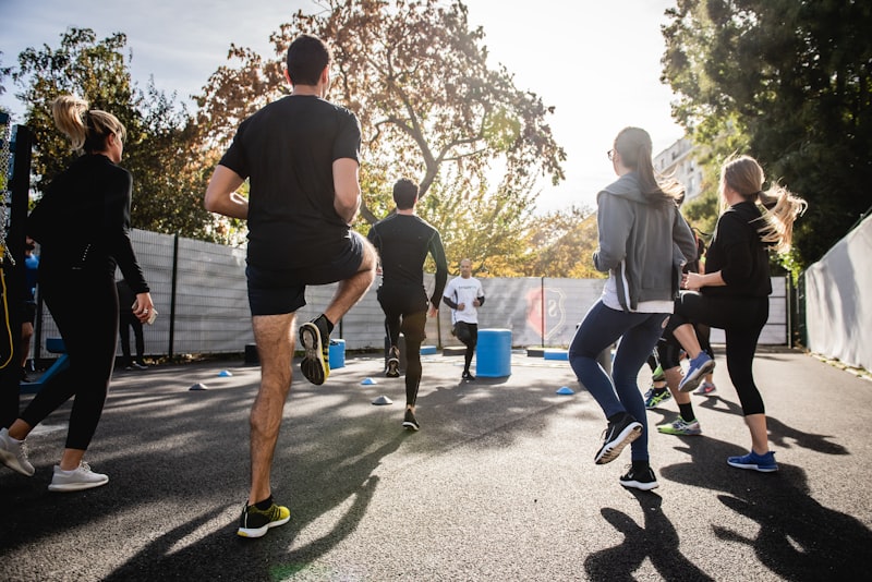 A person cooling down with a slow walk and a water bottle after a workout